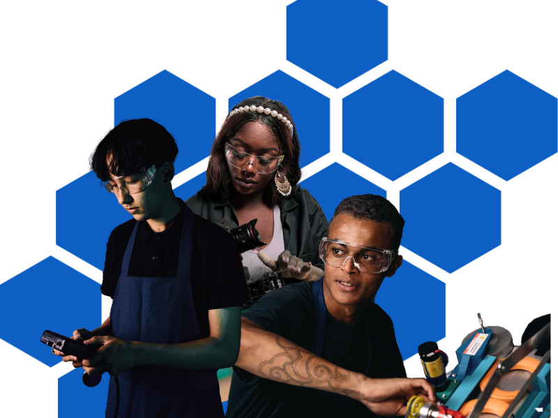 Three people working with electronics.